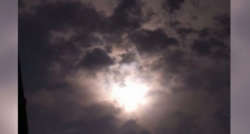 Night Sky Over Ipoh With Dark Clouds And Bright Flash.