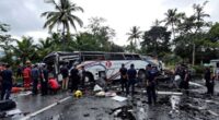 Damaged Bus At Accident Site With Emergency Responders Present.