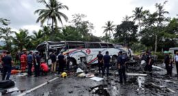 Damaged Bus At Accident Site With Emergency Responders Present.