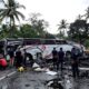 Damaged Bus At Accident Site With Emergency Responders Present.