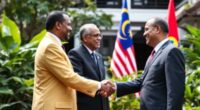 Ethiopian Prime Minister And Malaysian Leaders Shaking Hands Outdoors.