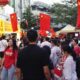 Crowd At Malaysian Cultural Event With China Flags.