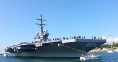 Uss Abraham Lincoln Docked In Malaysia With Naval Personnel.