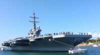 Uss Abraham Lincoln Docked In Malaysia With Naval Personnel.