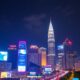 Kuala Lumpur Skyline At Night With Vibrant City Lights.