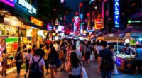 Nighttime Street Scene With Tourists Shopping In Malaysia.