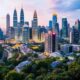 Kuala Lumpur Skyline With Greenery, Reflecting Malaysia'S Transformation.