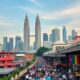 Kuala Lumpur Skyline With Petronas Towers And Busy Streets.